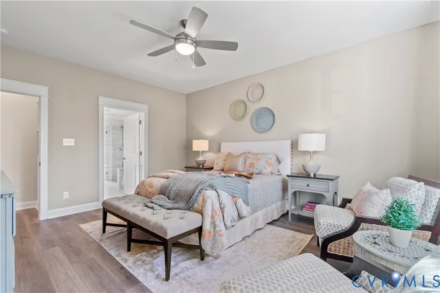 a bedroom with bed furniture and wooden floor