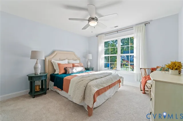 a bed room with a bed and a window