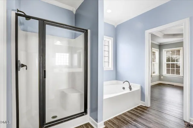a view of entryway and hall with wooden floor