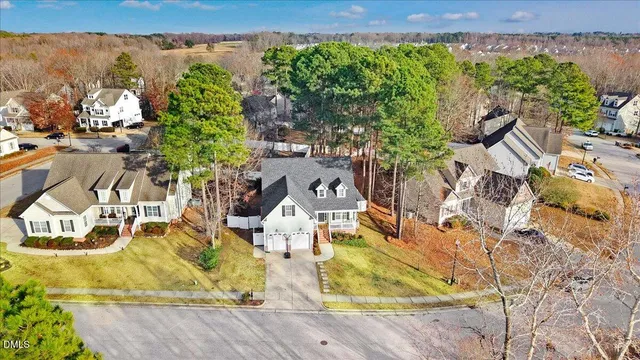 a house that has a tree in front of it
