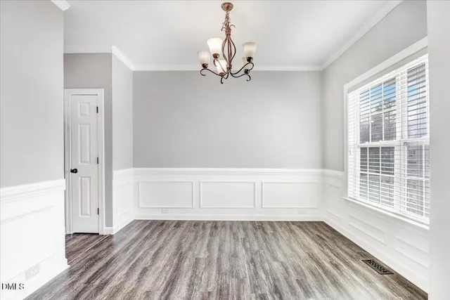 a view of a hallway view with wooden floor and staircase