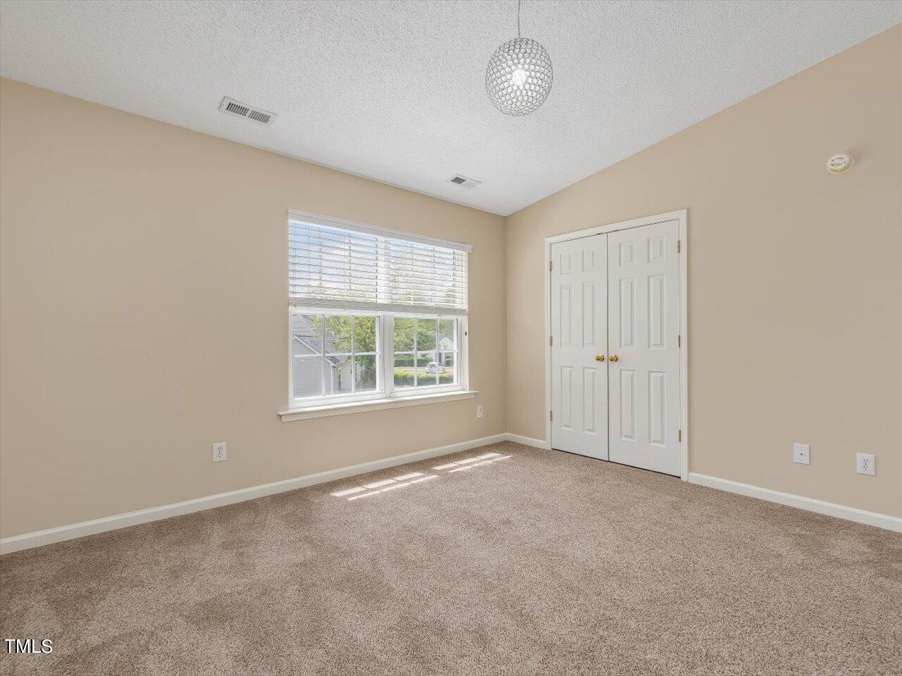 5402 Patuxent Drive Raleigh, NC 27616 - Photo 12 of 27 a view of an empty room with a window