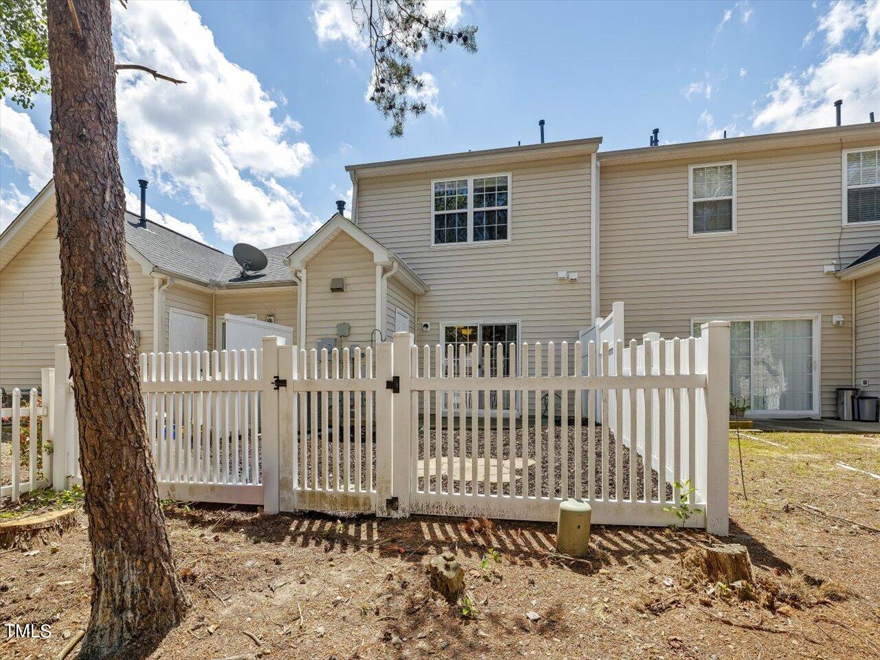 5402 Patuxent Drive Raleigh, NC 27616 - Photo 18 of 27 a front view of a house with a garden