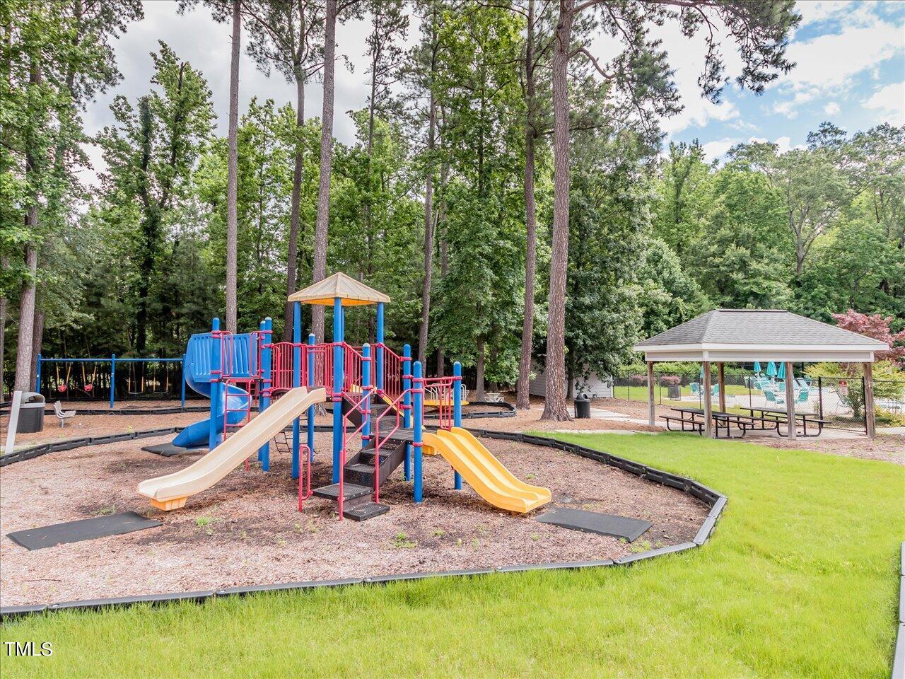5402 Patuxent Drive Raleigh, NC 27616 - Photo 23 of 27 a view of a slide with a house