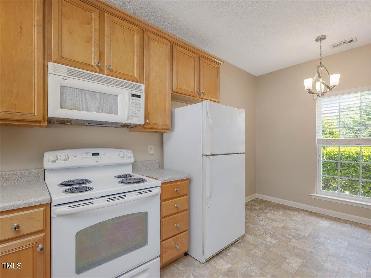 5402 Patuxent Drive Raleigh, NC 27616 - Photo 6 of 27 a utility room with dryer and washer