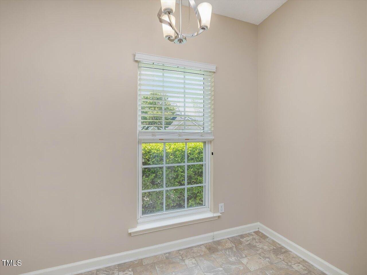 5402 Patuxent Drive Raleigh, NC 27616 - Photo 7 of 27 an empty room with a window