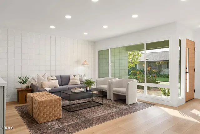 a living room with furniture and a window