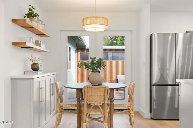 a spacious bedroom with a bed and a window