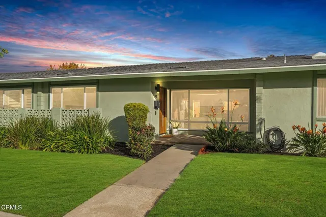 a view of a house with sign board
