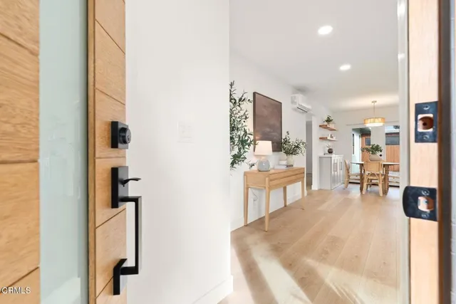 a view of kitchen with furniture and refrigerator