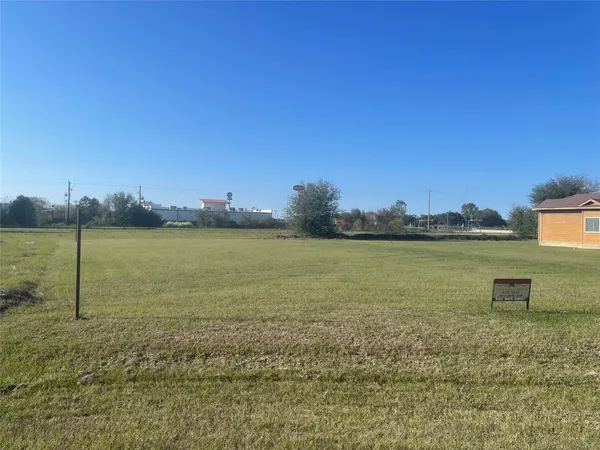 a view of a lake with a big yard