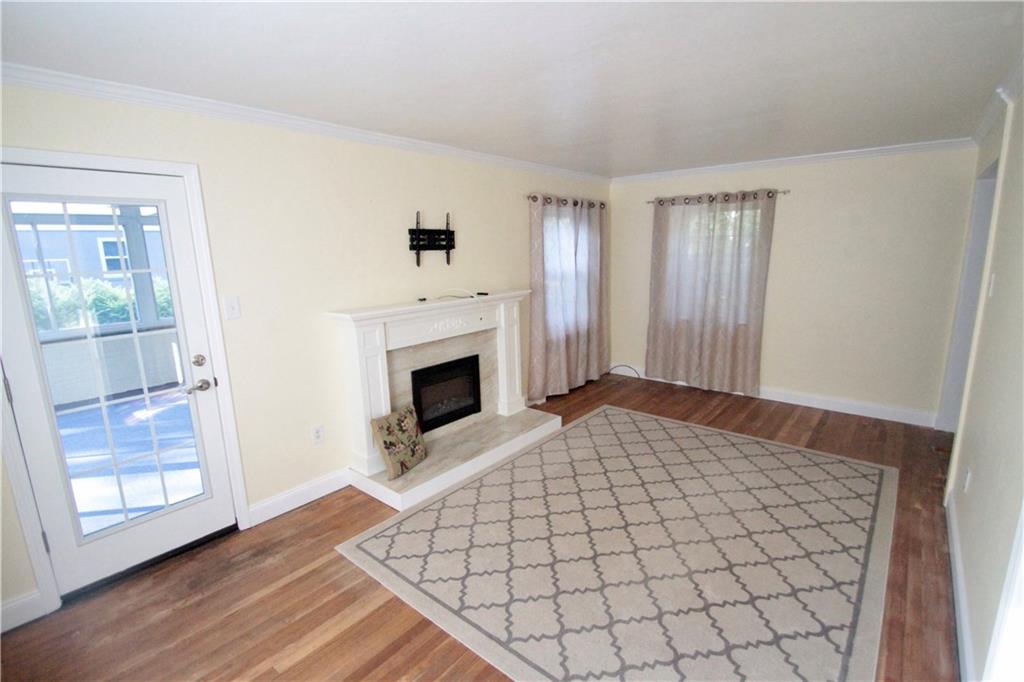 144 Ridgewood Road Pittsburgh, PA 15237 - Photo 5 of 22 Large bright living room with beautiful focal point fireplace.