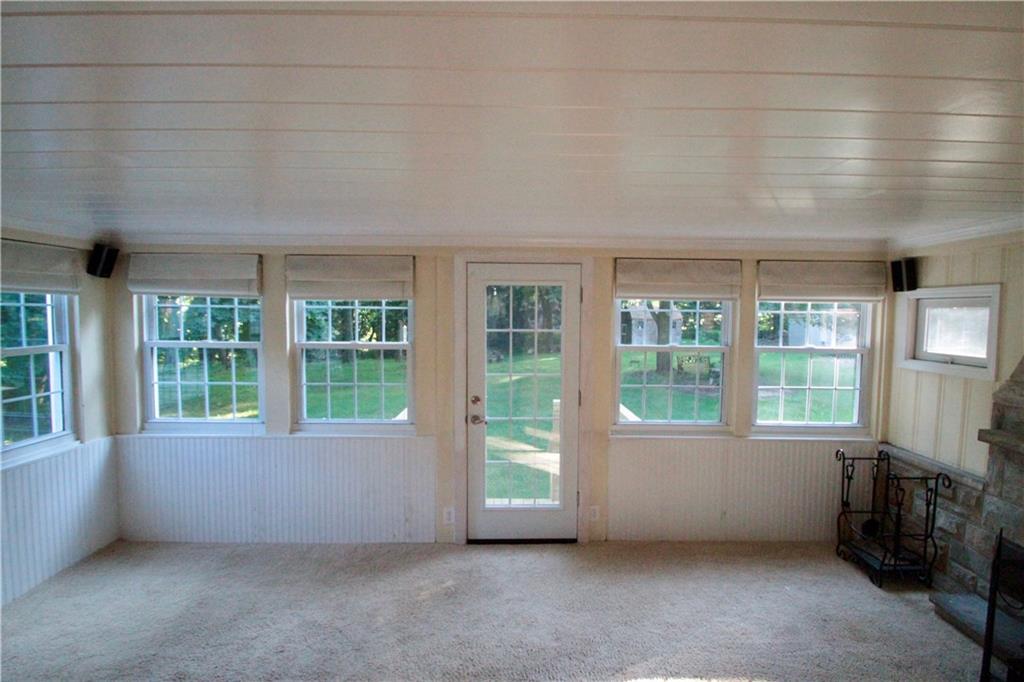 144 Ridgewood Road Pittsburgh, PA 15237 - Photo 10 of 22 The family room, wall of windows with back door leading out the parklike backyard.