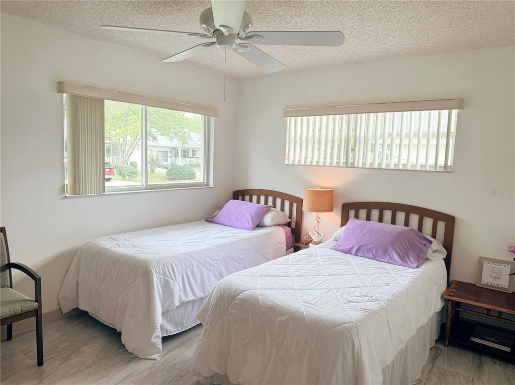 9394 Southwest 97th Lane, Unit A Ocala, FL 34481 - Photo 17 of 22 a bedroom with two beds and a window