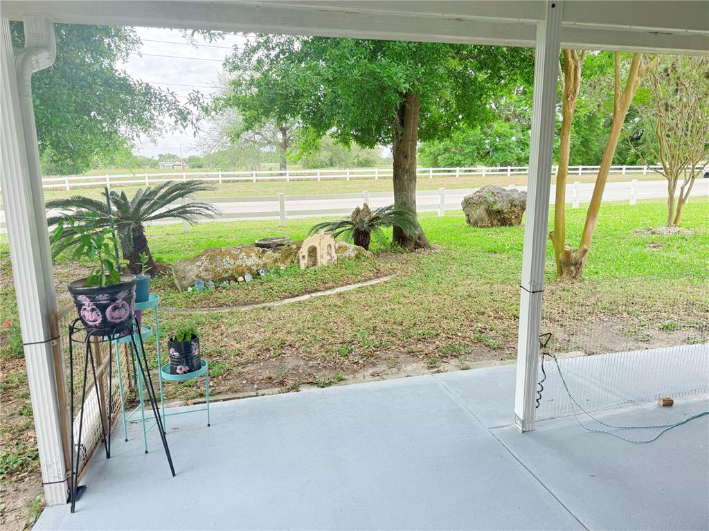 9394 Southwest 97th Lane, Unit A Ocala, FL 34481 - Photo 21 of 22 a view of a porch with a backyard