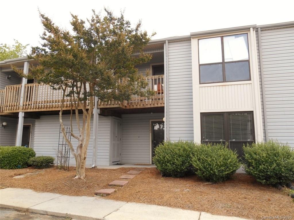 11183 Harrowfield Road Charlotte, NC 28226 - Photo 2 of 20 a front view of a house with a yard and garage