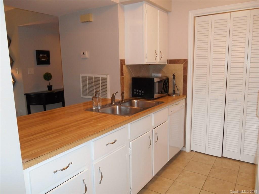 11183 Harrowfield Road Charlotte, NC 28226 - Photo 11 of 20 a room with two washing machine and a fireplace