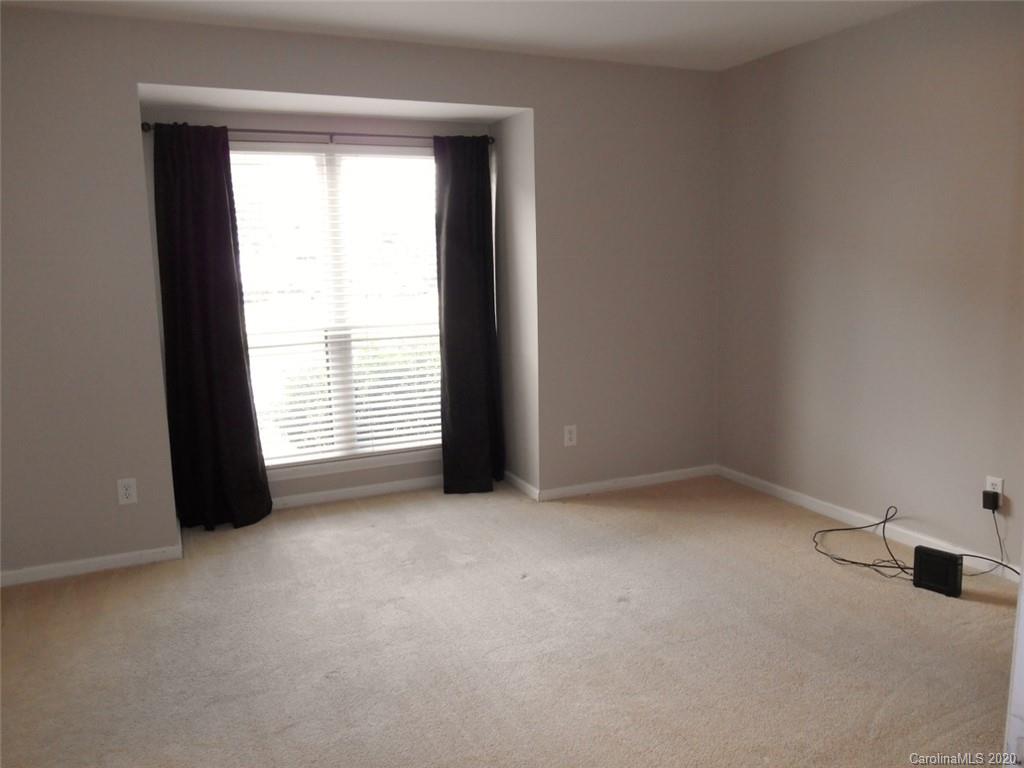 11183 Harrowfield Road Charlotte, NC 28226 - Photo 12 of 20 an empty room with a window