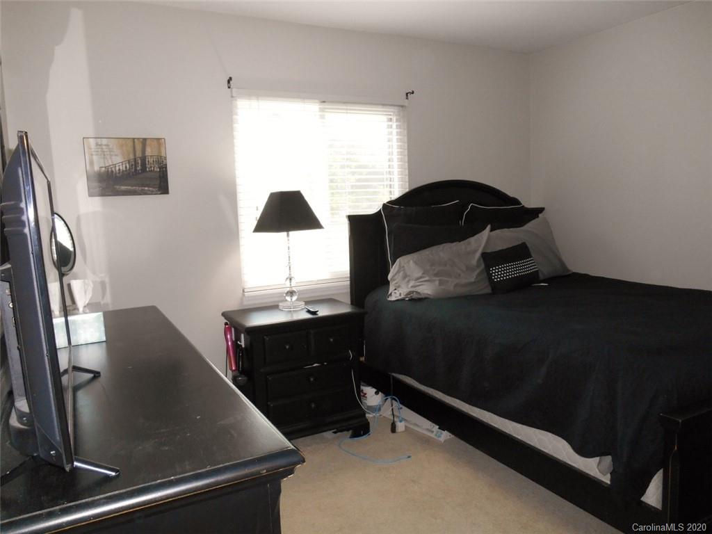 11183 Harrowfield Road Charlotte, NC 28226 - Photo 15 of 20 a bedroom with a bed and a dresser