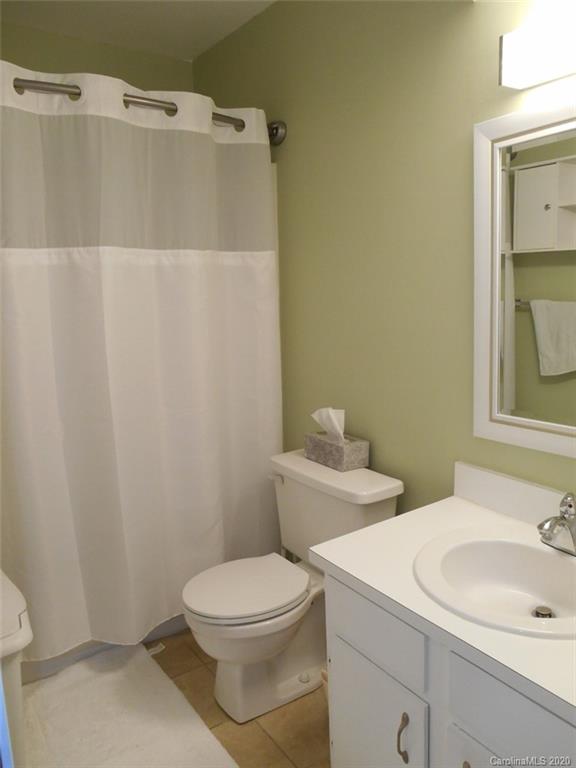 11183 Harrowfield Road Charlotte, NC 28226 - Photo 16 of 20 a bathroom with a sink a toilet and shower