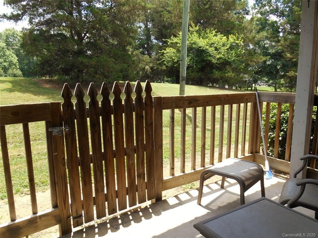 11183 Harrowfield Road Charlotte, NC 28226 - Photo 17 of 20 a view of balcony with wooden floor and outdoor seating