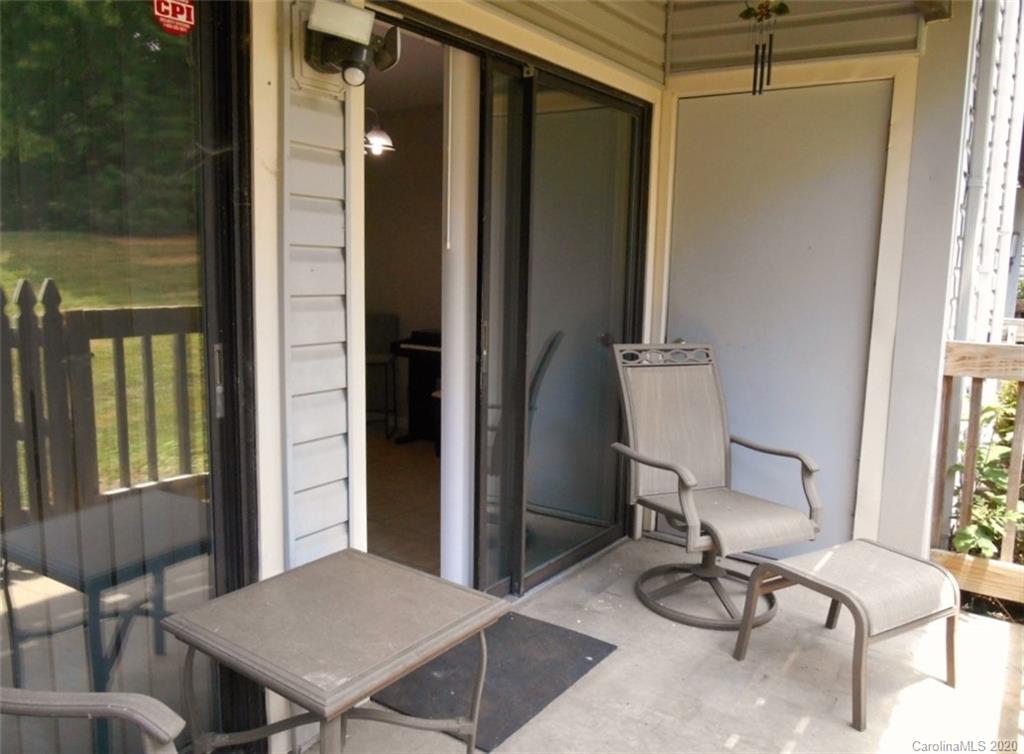 11183 Harrowfield Road Charlotte, NC 28226 - Photo 19 of 20 a view of a room that has a window and chair in it