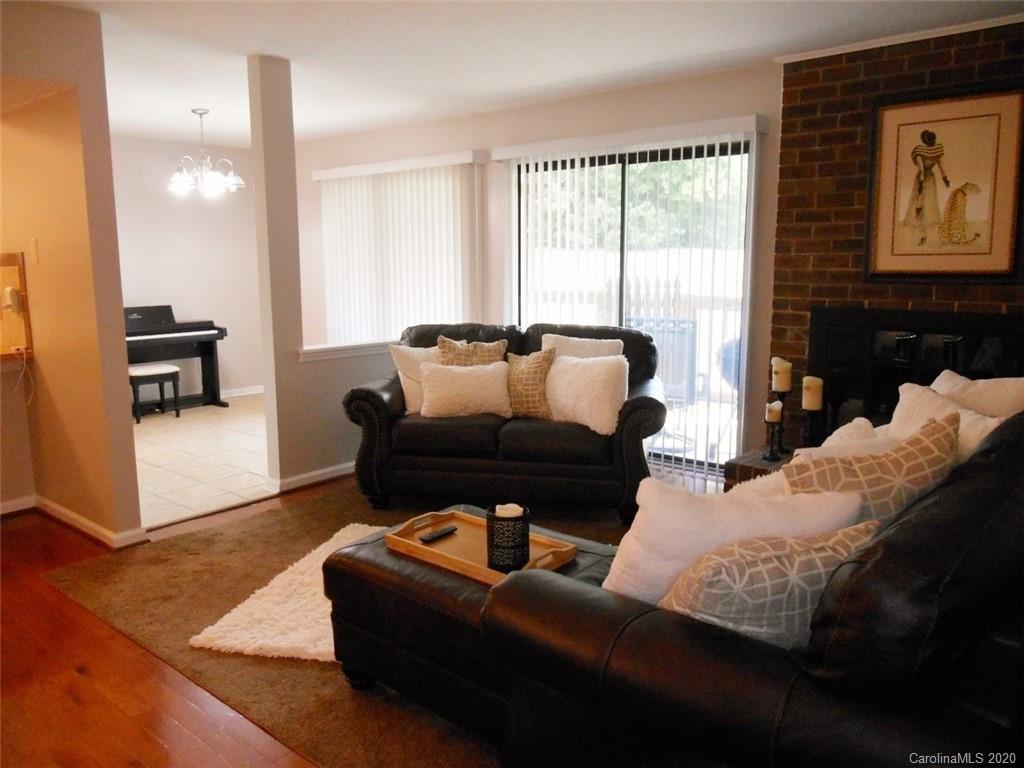 11183 Harrowfield Road Charlotte, NC 28226 - Photo 7 of 20 a living room with furniture and a large window
