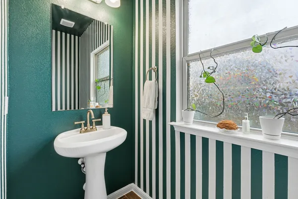 a bathroom with a sink and mirror