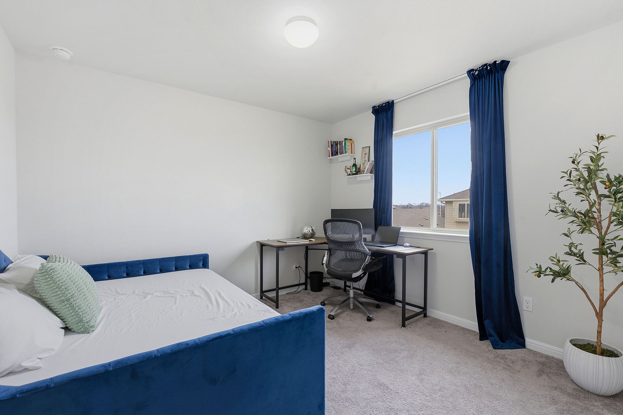 12413 Ostrich Trail Manor, TX 78653 - Photo 22 of 29 Bedroom featuring light carpet and an office area