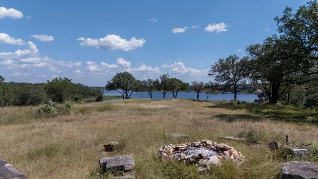 a view of a lake with houses in the background