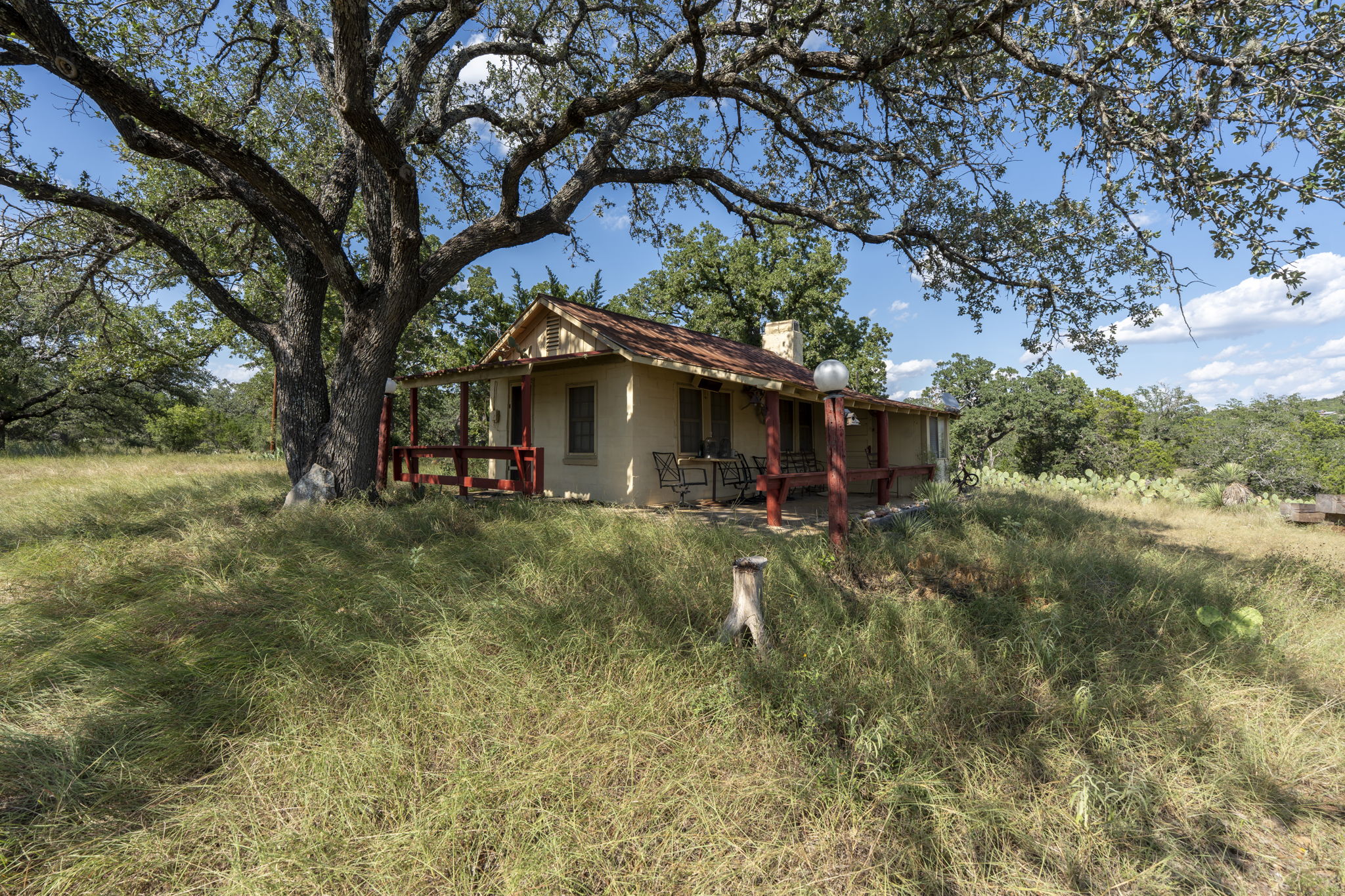Tbd Singleton Road Marble Falls, TX 78654 - Photo 23 of 40 a view of patio with a table and chairs under an umbrella