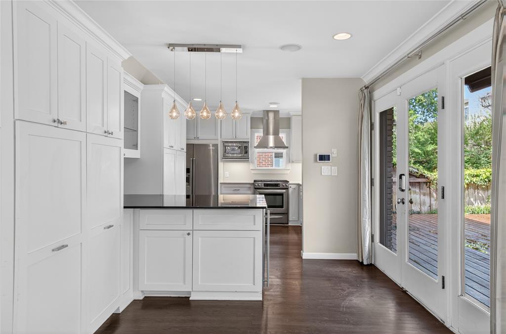 4009 Prescott Avenue Dallas, TX 75219 - Photo 7 of 39 Breakfast bar built in with granite top and wine fridge