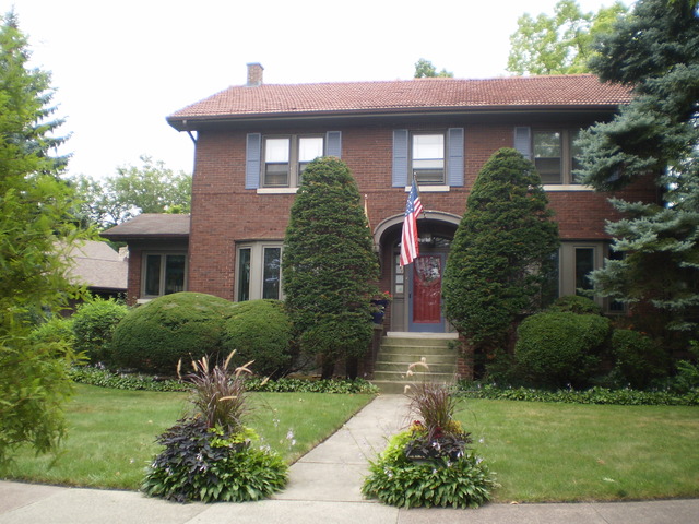 197 Longcommon Road Riverside, IL 60546 - Photo 2 of 25 a front view of a house with garden
