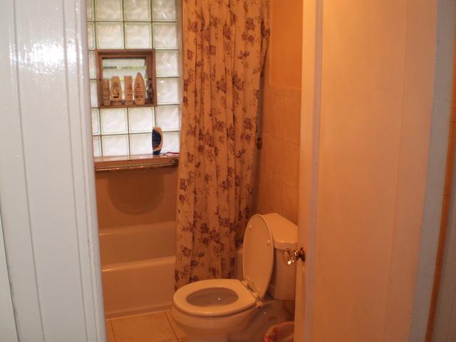 197 Longcommon Road Riverside, IL 60546 - Photo 13 of 25 a bathroom with a toilet and a shower