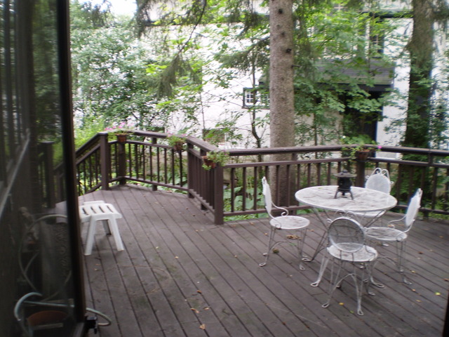 197 Longcommon Road Riverside, IL 60546 - Photo 18 of 25 a balcony with wooden floor table and chairs