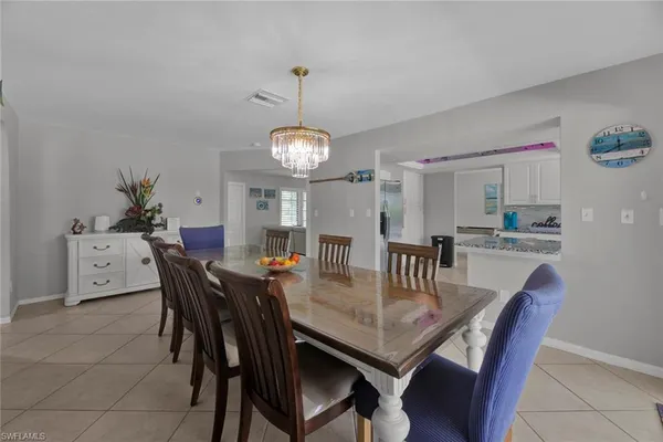 a view of a dining room and livingroom with furniture