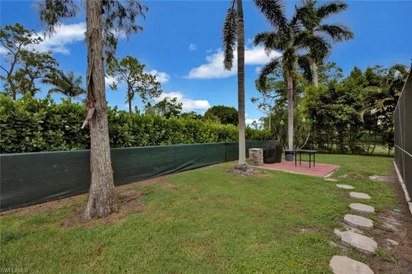 a backyard of a house with lots of green space