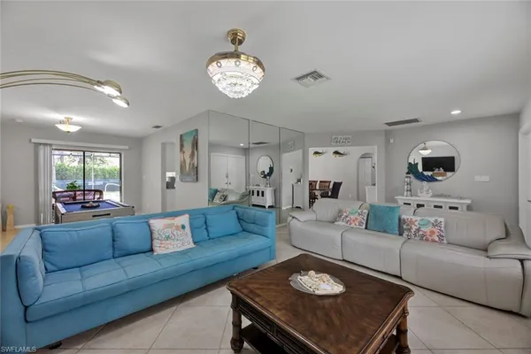 a living room with furniture and a table