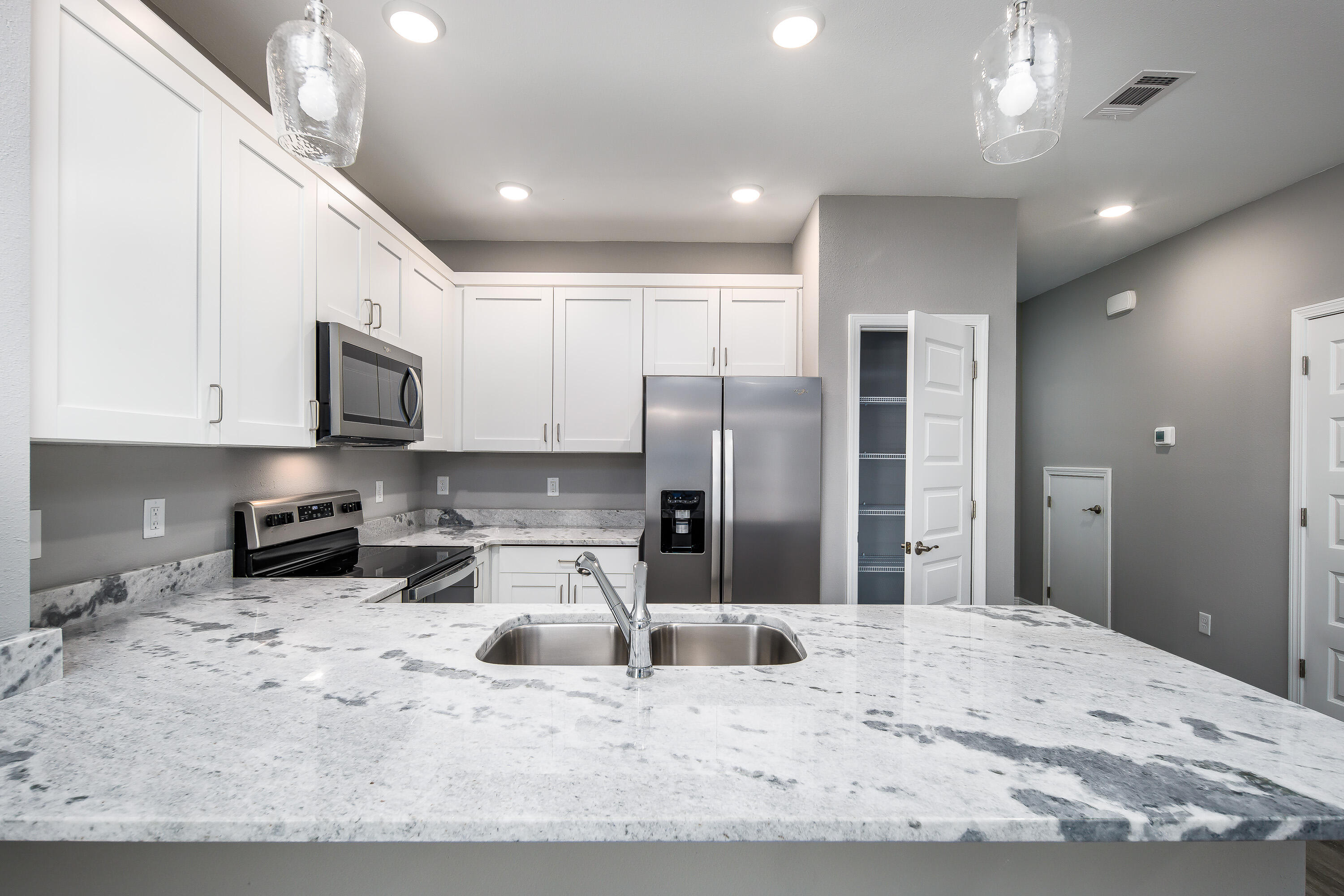 969 Skylark Road Mary Esther, FL 32569 - Photo 1 of 31 a large kitchen with kitchen island a sink stainless steel appliances and cabinets
