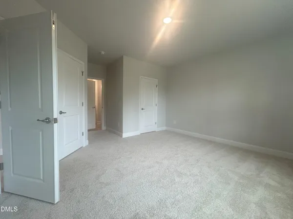 a view of livingroom and hallway with windows