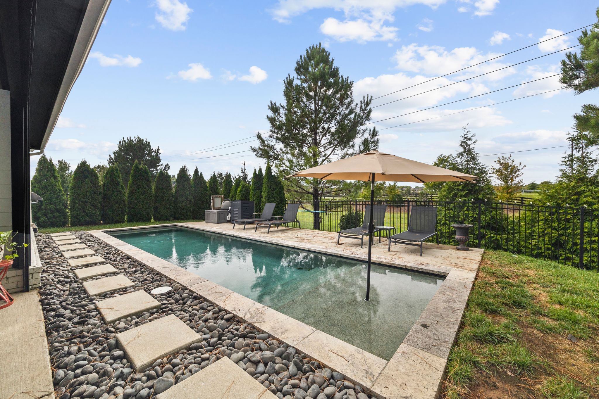 a view of a swimming pool with a patio