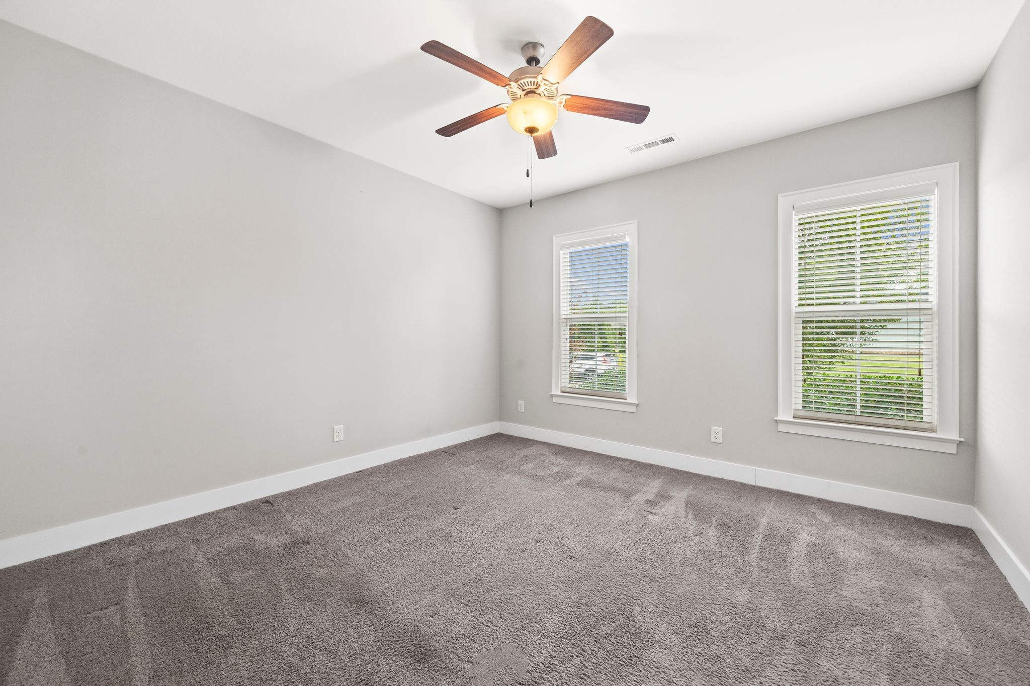 5001 Ryecroft Lane Franklin, TN 37064 - Photo 16 of 19 an empty room with windows and fan