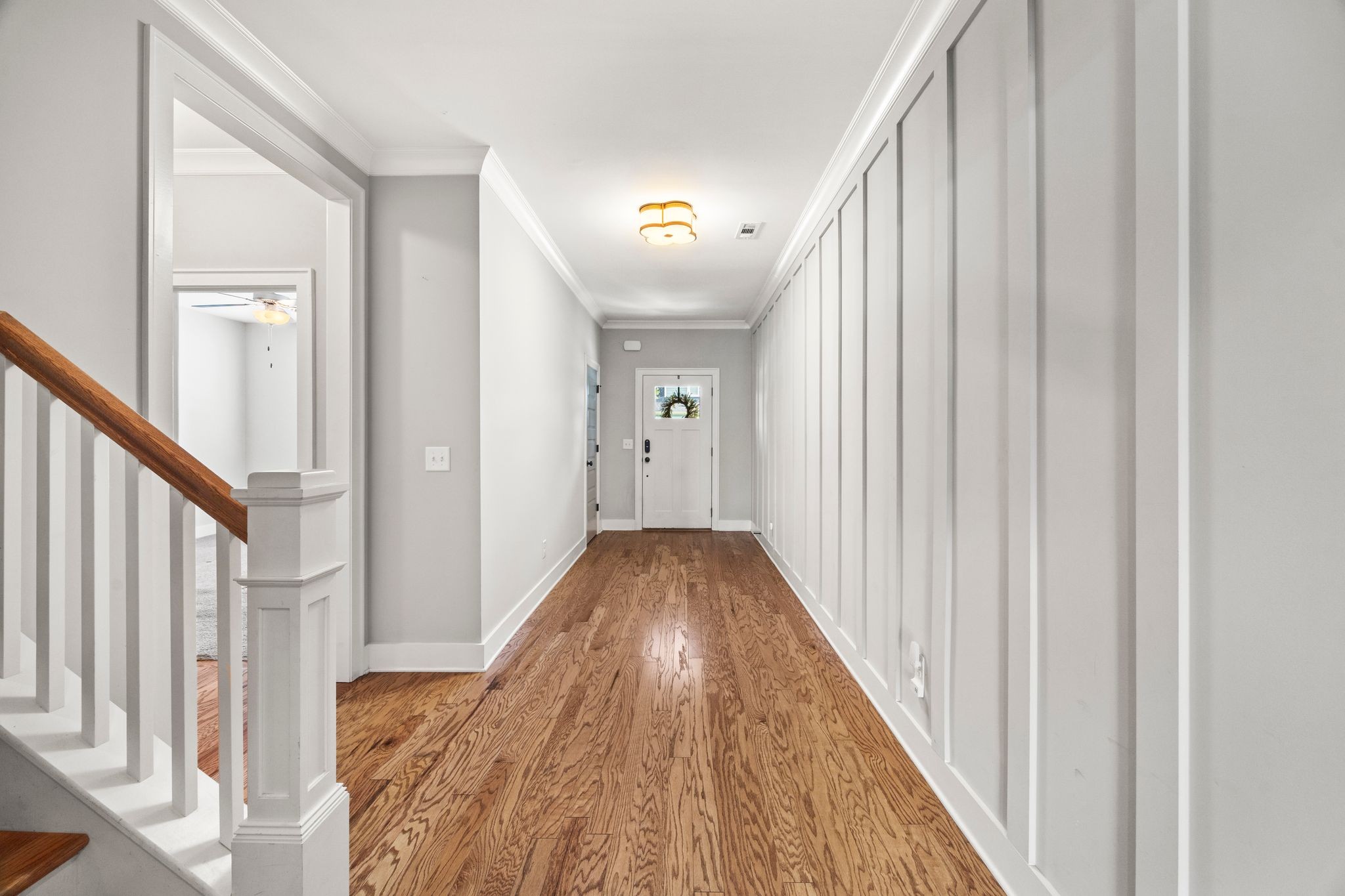5001 Ryecroft Lane Franklin, TN 37064 - Photo 4 of 19 a view of a hallway with wooden floor and staircase