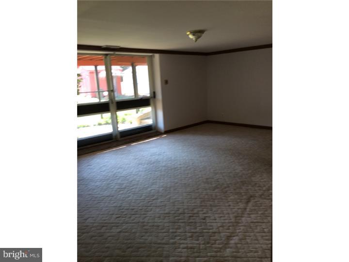 1152 R Norwalk Road Philadelphia, PA 19115 - Photo 9 of 20 a view of an empty room with a window