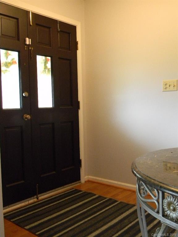 416 Willow Road Salisbury, NC 28147 - Photo 2 of 19 a view of a livingroom with wooden floor and windows