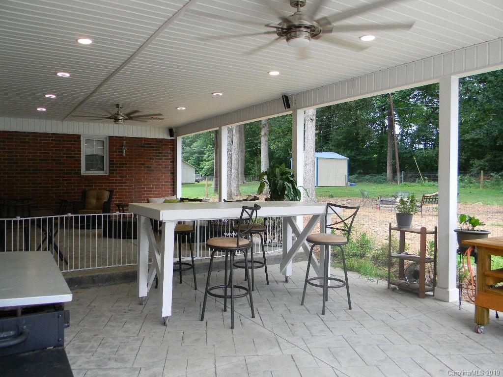416 Willow Road Salisbury, NC 28147 - Photo 17 of 19 a view of a patio with a table and chairs
