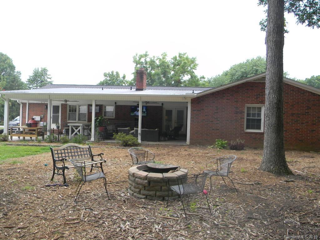 416 Willow Road Salisbury, NC 28147 - Photo 18 of 19 a view of a house with backyard sitting area and garden