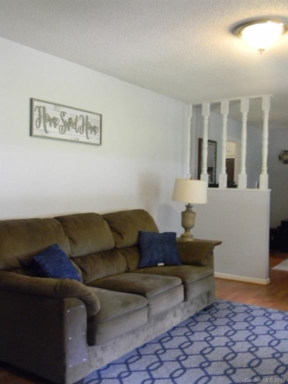 416 Willow Road Salisbury, NC 28147 - Photo 3 of 19 a living room with furniture and painting on the wall
