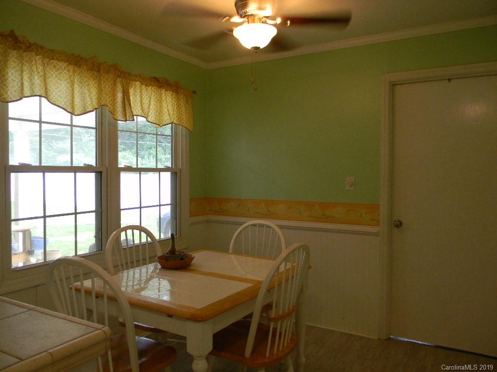 416 Willow Road Salisbury, NC 28147 - Photo 7 of 19 a view of a dining room with furniture and chandelier
