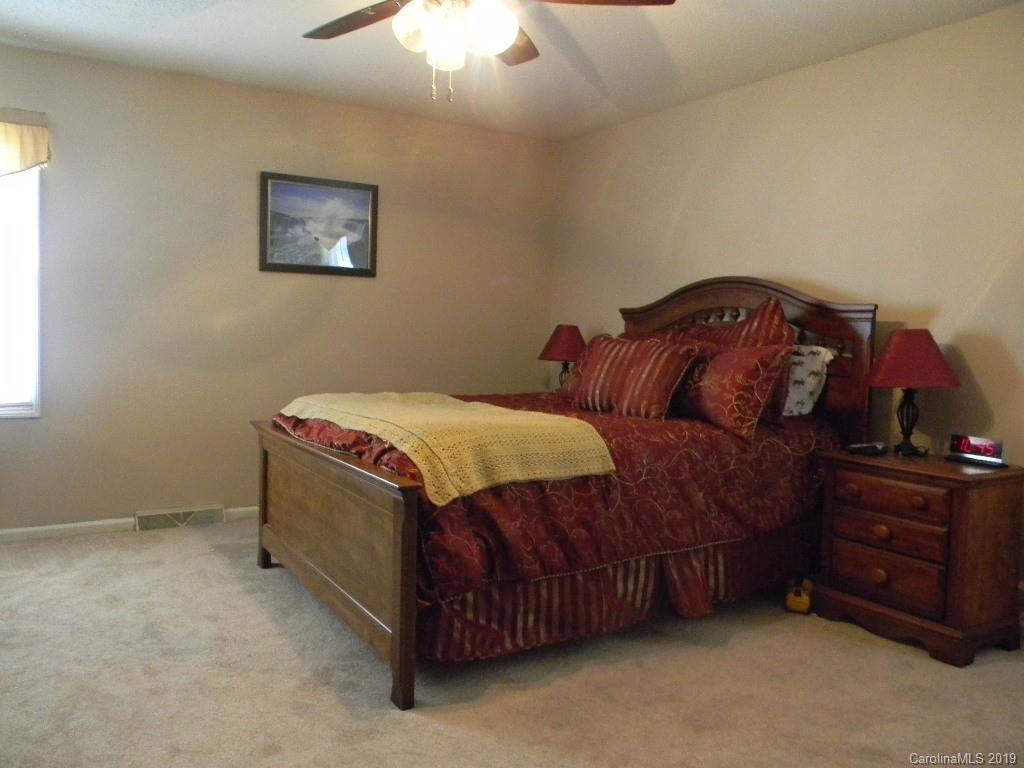 416 Willow Road Salisbury, NC 28147 - Photo 9 of 19 a bedroom with a bed and a dresser